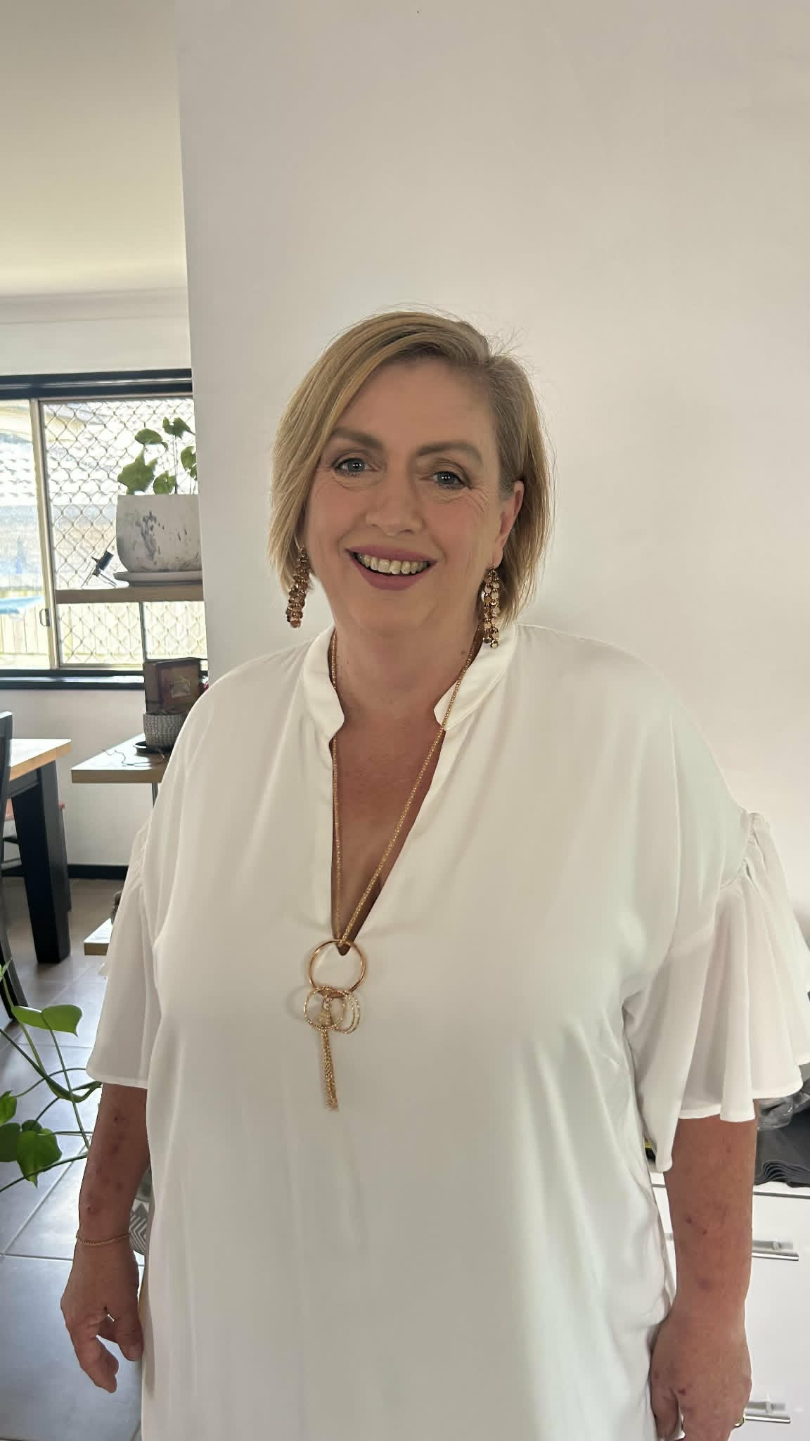 Kay Power smiling at home